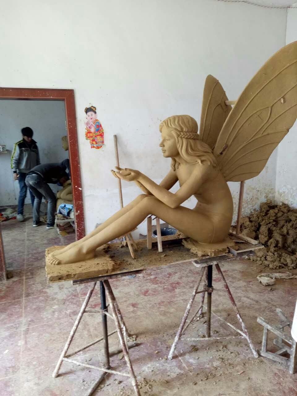 clay model of angel statue